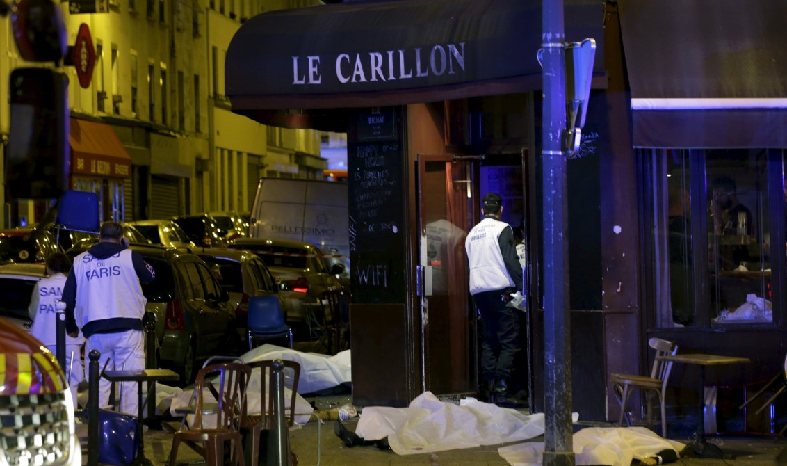 ATTENTION EDITORS - VISUAL COVERAGE OF SCENES OF INJURY OR DEATH A general view of the scene that shows the covered bodies outside a restaurant following a shooting incident in Paris, France, November 13, 2015. REUTERS/Philippe WojazerTEMPLATE OUT TPX IMAGES OF THE DAY